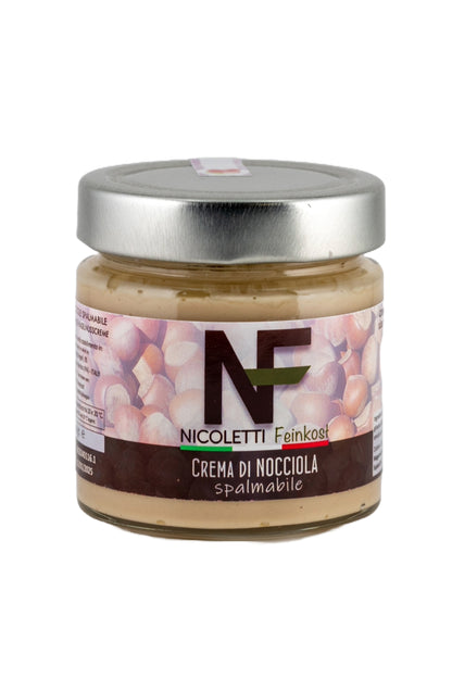 Glas mit Crema di Nocciola (230g), hergestellt in Sizilien für Nicoletti Feinkost Schongau, aus hochwertigen Haselnüssen, handwerkliche Haselnusscreme mit intensivem, aromatischem Geschmack, ideal als Aufstrich, in Desserts oder pur.